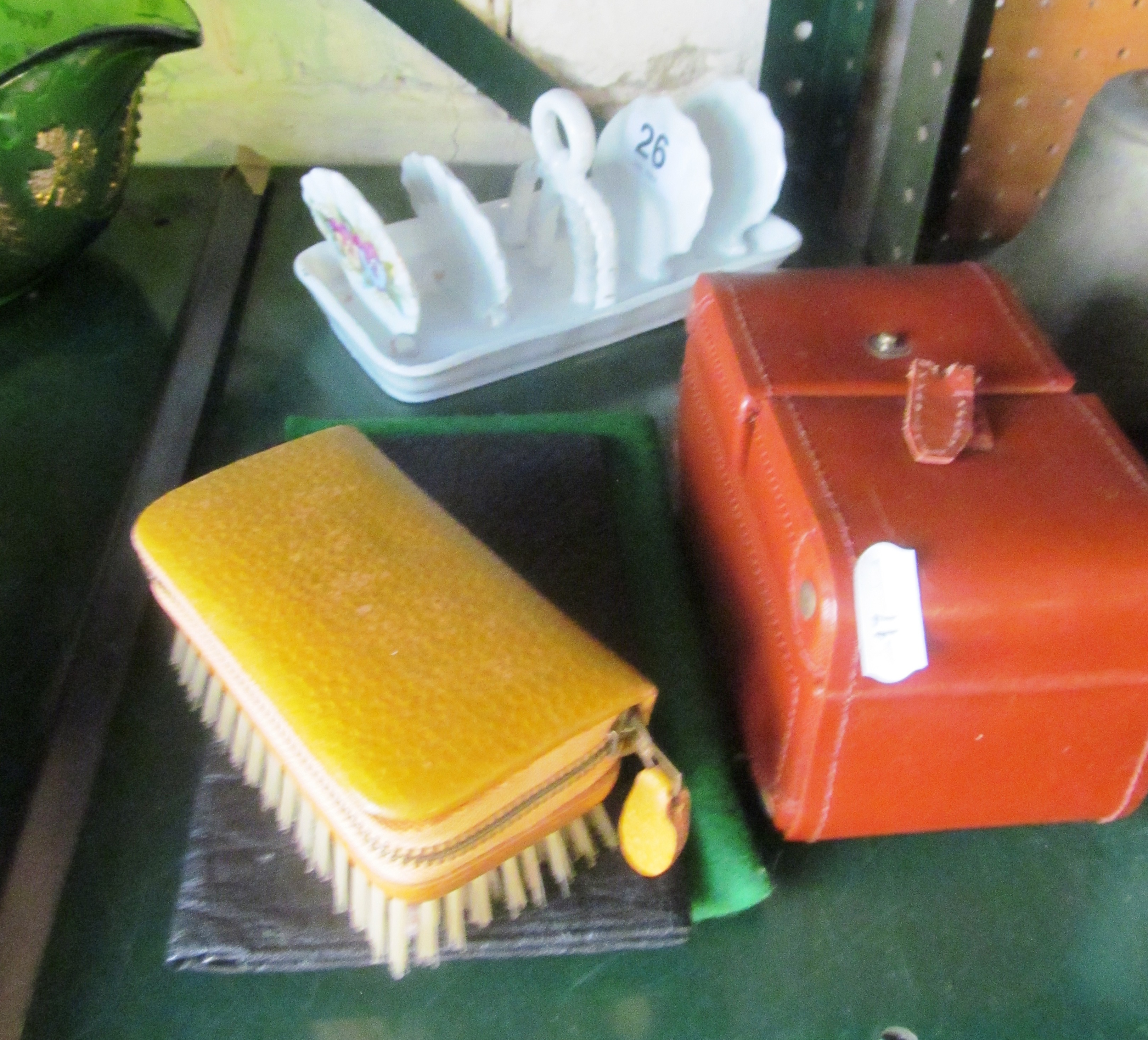 A purse, brush set and toastrack.