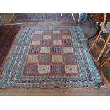 A Persian rug twenty square central design and multi border