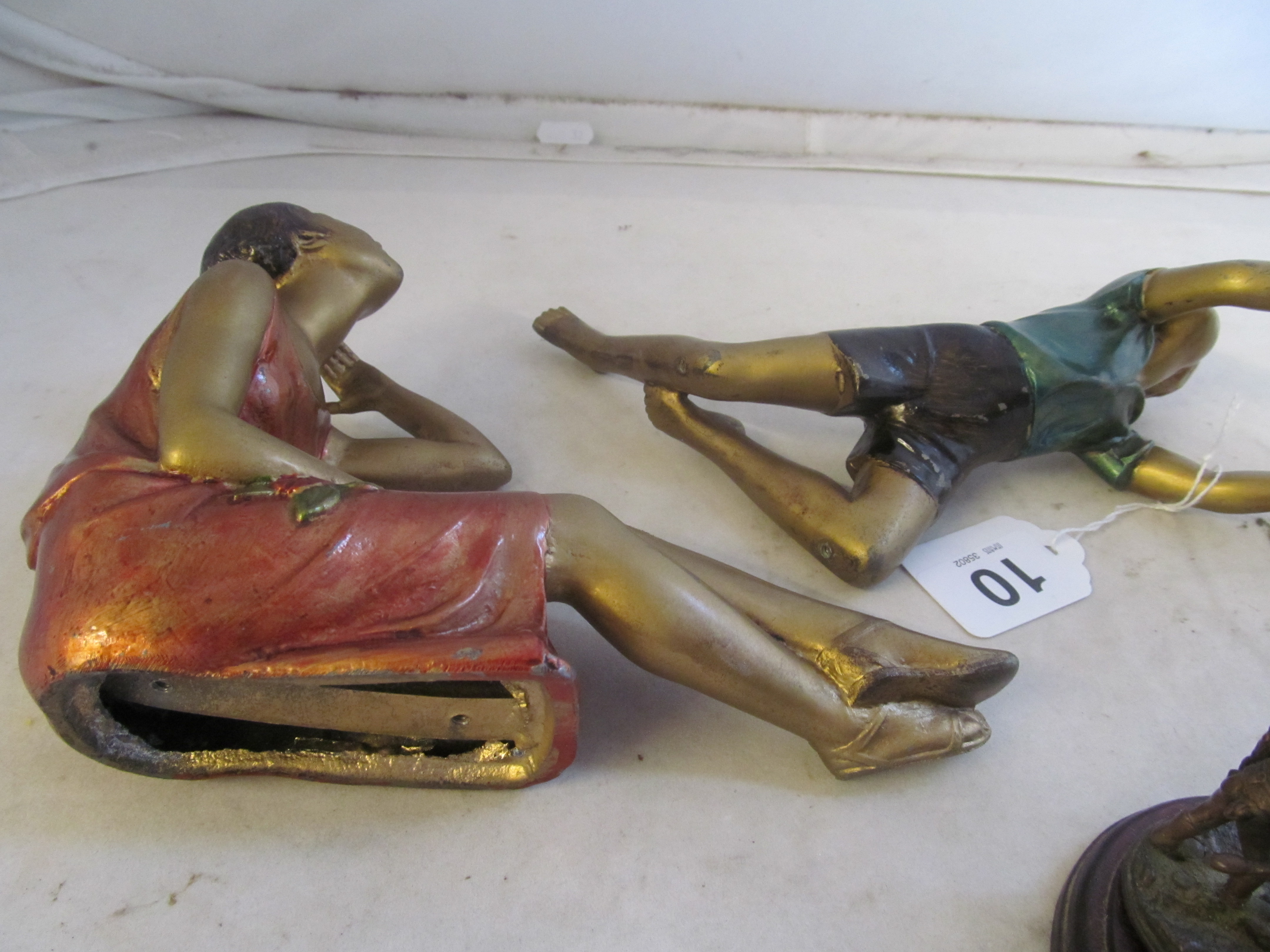 Two 1930s gilt and coloured figures (deficient of stands) and a metal figure Horse Power. - Image 2 of 2