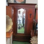 An Edwardian mahogany wardrobe with drawer