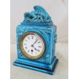 A Burmantofts clock Faience clock, model 1431, top modelled as grotesque dragon glazed blue,