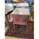 A mahogany bedside cabinet with slide