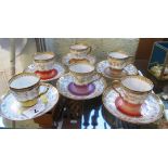 A Harlequin set of six Limoges cups and saucers with leaf and flower banding and gilt decoration (
