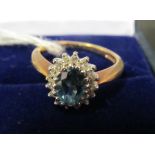 A blue stone cluster ring.