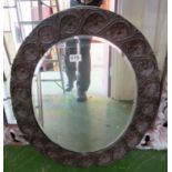 A carved oak mirror