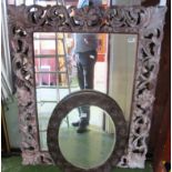 A large carved wood mirror