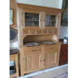 A lightwood kitchen dresser