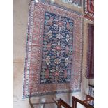 A Persian rug blue central ground