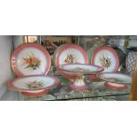 A Royal Worcester part dessert set pink border and handpainted flowers: three plates, two comports