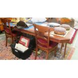 An Edwardian oak dining table on octagonal base, canted sides, with two leaves.