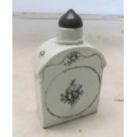 A porcelain bottle with black transfer print design and black wood stopper