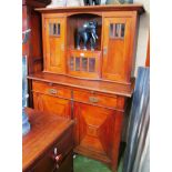 An oak dresser with cupboards above, and two drawers and two cupboards under.