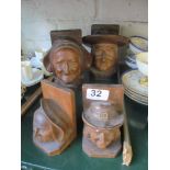 A pair carved Brittany bookends man and woman and another smaller pair