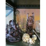 Three resin modern Oriental ornaments, two carved figures, brass easel and bookend