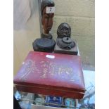 A carved African bust, face ornament, ammonite, oriental box and miniature teapot on stand