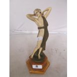 An Art Deco style resin figure semi-nude lady.