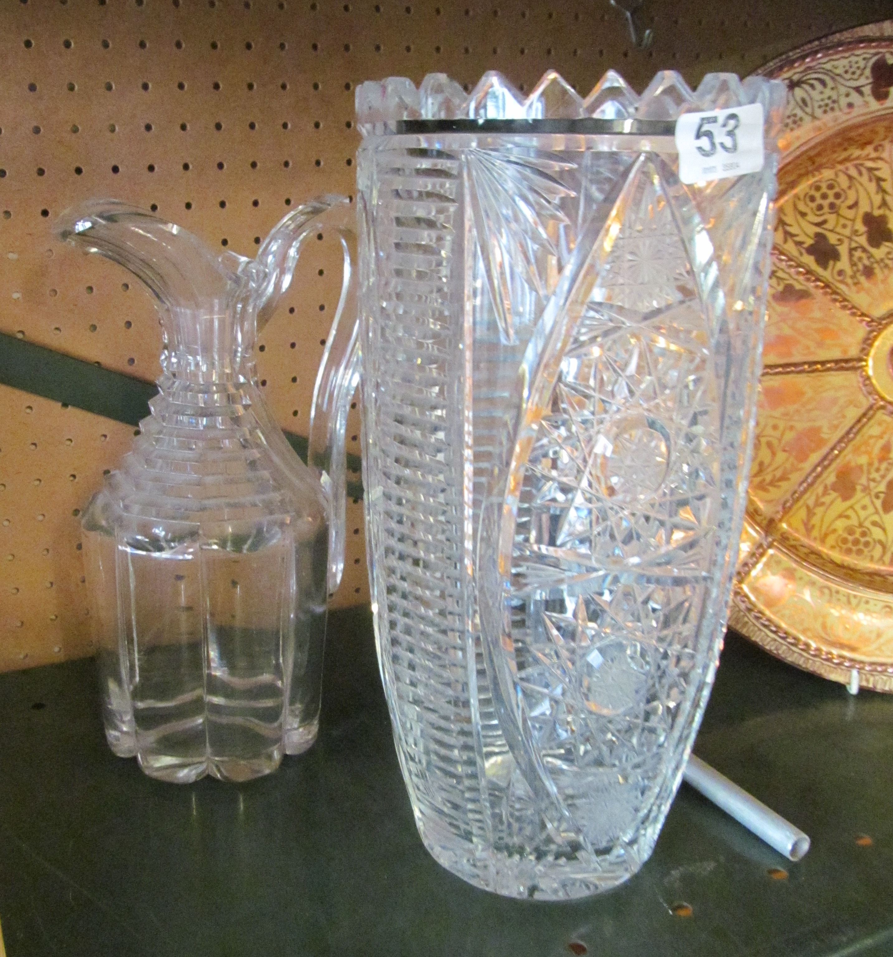 A cut glass vase and jug