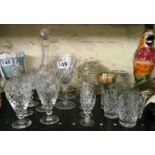 A decanter and various drinking glasses