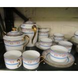 A Limoges coffee set:- coffee pot, milk and lidded sugar, six cups and saucers with turquoise