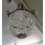 A glass bag chandelier with wreath motif to rim