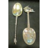 A foreign import spoon with ship finial and gentleman and another spoon with apostle finial