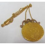 A Georgian gold Guinea coin mounted on chain (very worn)