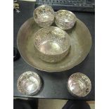 A silver bowl and four bowls and a Turkish bowl