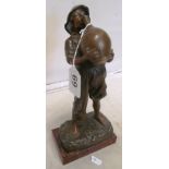 A bronze figure boy drinking on marble effect base