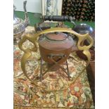 A copper kettle on heater stand and a brass stand