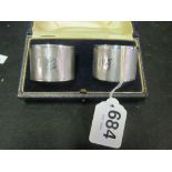 A pair of silver napkin rings (i.c)