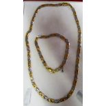 An 18ct yellow and white gold Gucci link necklace with matching bracelet 45gms