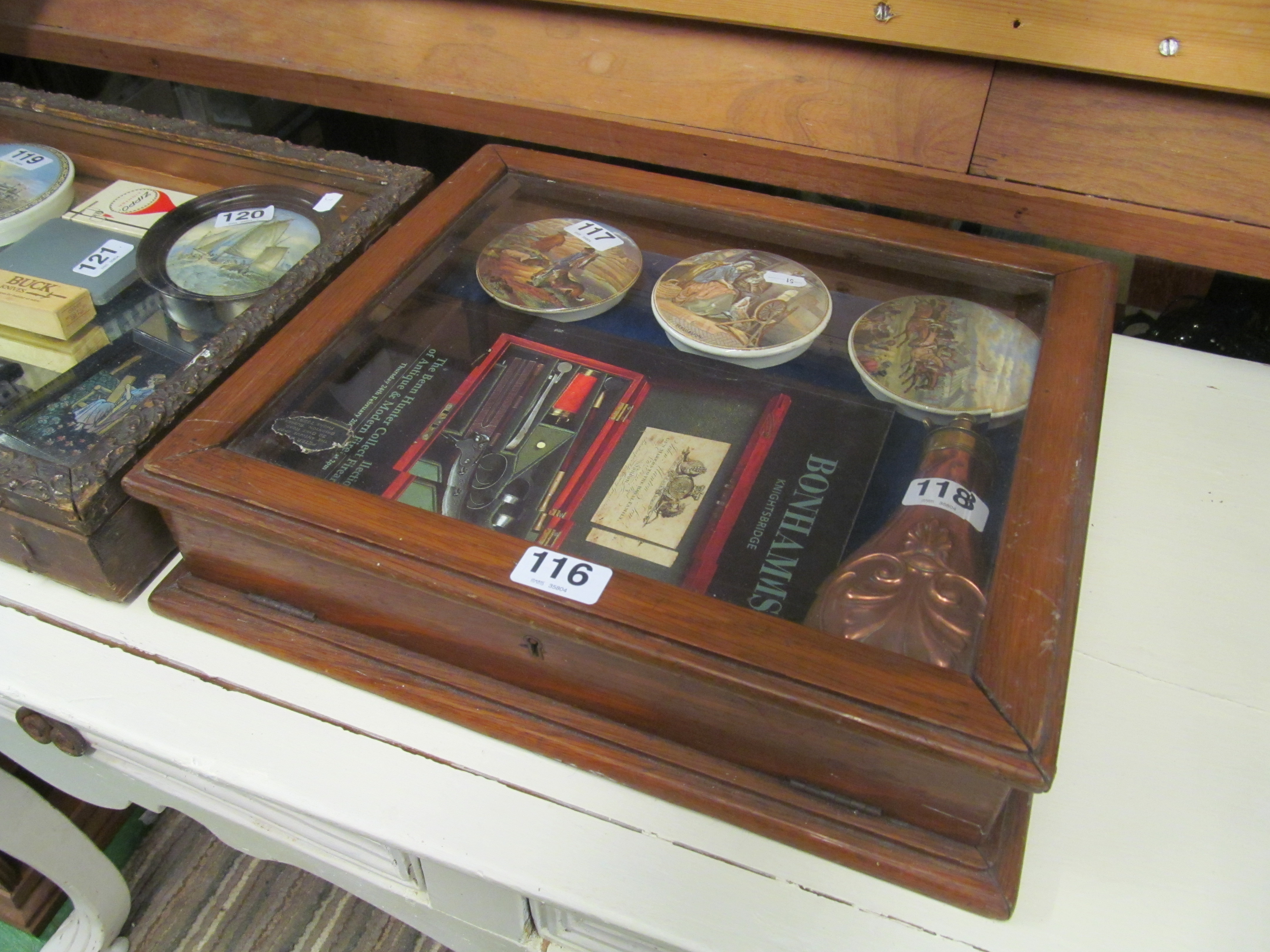 Two table top vitrine cabinets.