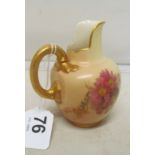 A Royal Worcester jug Rd No 29115 decorated pink flowers with gilded handle