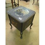 A black lacquer needlework table, lid rubbed