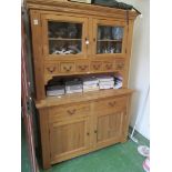 A lightwood kitchen dresser