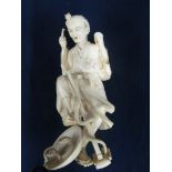 A 19th Century ivory figure man with snake and basket, signed (a/f).