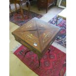 A late Victorian rosewood and inlaid envelope card table with drawer on shaped supports round a