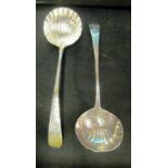 A pair of Georgian silver shell bowl ladles