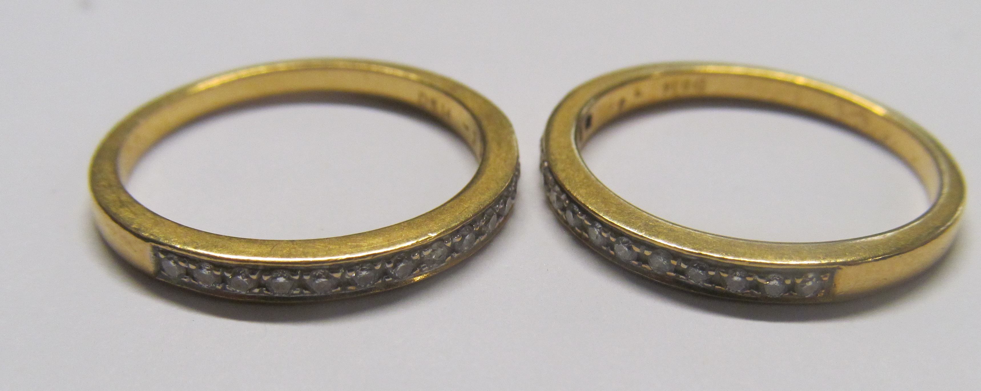 A pair of 18ct diamond eternity rings