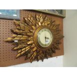 A Smiths electric sunburst wall clock