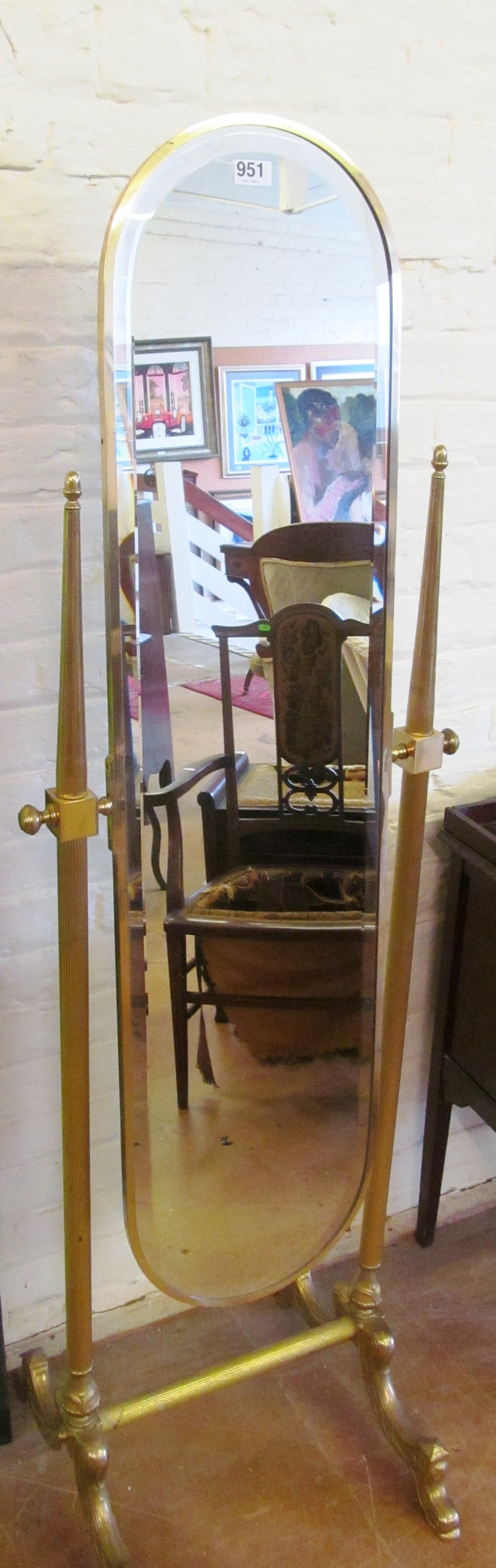 A bevel edge brass cheval mirror.