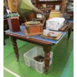 A Victorian mahogany dining table with two interleaves and winding handle