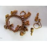 A 9ct gold charm bracelet and loose charms