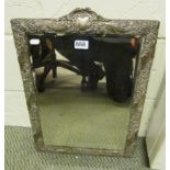 A large silver framed dressing table mirror embossed flowers with initials to top and dates 1879 and
