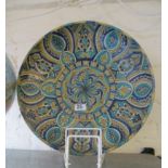 A continental pottery plaque Persian design