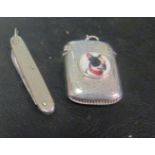 A silver match striker and silver penknife