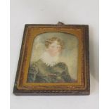 An early 19th Century miniature of a young man with frilled collar
