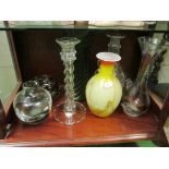 A glass decanter and other glass