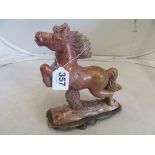 A Soapstone horse on stand