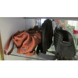 A Prada leather handbag, Mandarina Duck handbag and a black handbag